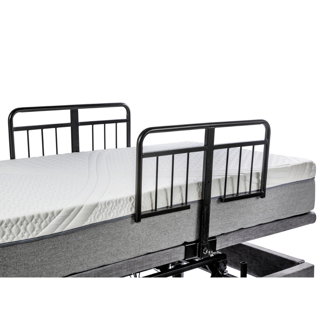The Golden Tech Passport Homecare Bed Accessories include an adjustable design featuring a white mattress, black metal side rails, and a gray frame. Perfect for integrating safety and mobility tools, the bed can be raised to showcase its mechanical structure underneath.